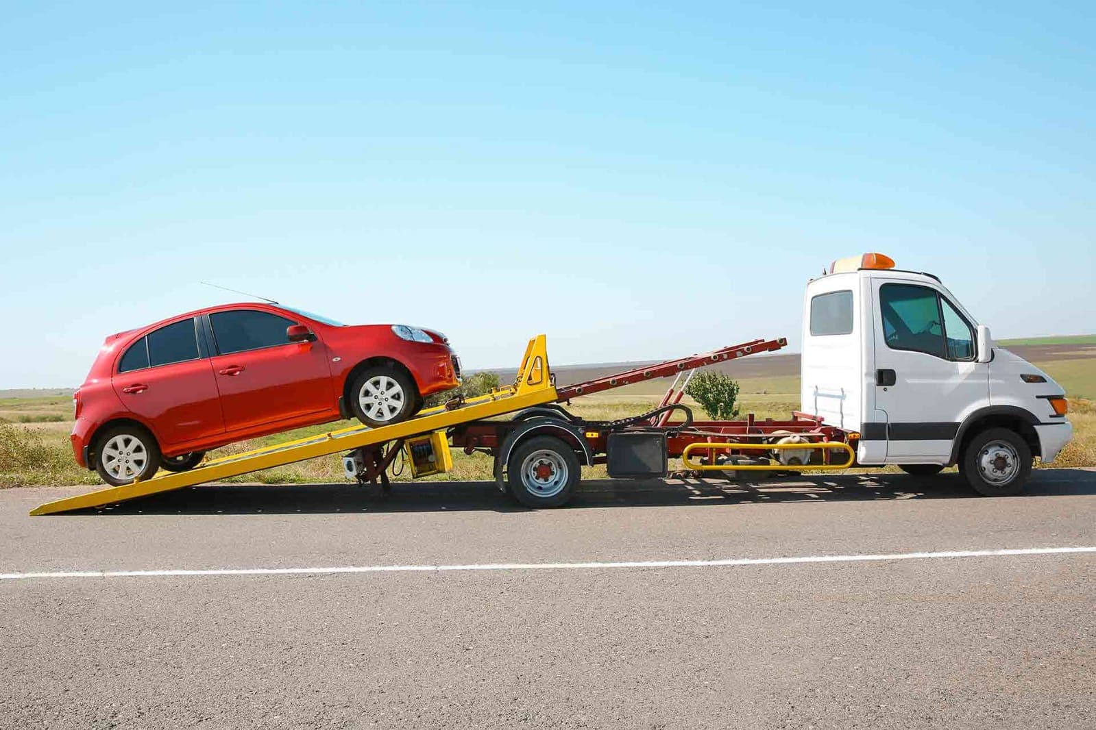 Car being recovered on a busy UAE highway
