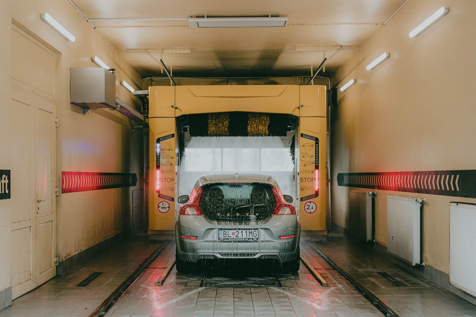 Car going through an automatic car wash tunnel