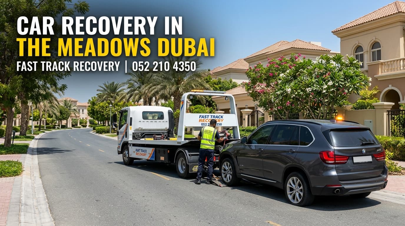 Fast Track Recovery towing a car on a residential road in The Meadows, Dubai